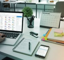 Desk with monitors and calendar