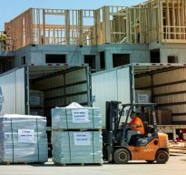 Construction site with materials and forklift